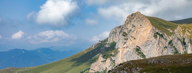 Summer mountains green grass and blue sky landscape