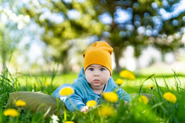 Summer outdoor childhood joy Cute little boy laying on a grass