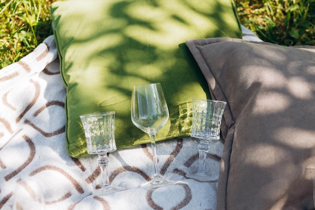 Summer picnic wine glasses on tablecloth