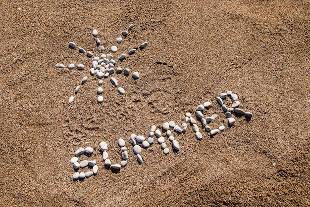 Summer picture from pebble and sand on a beach