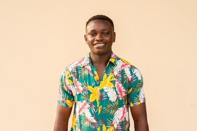 Summer portrait of handsome African man enjoying holiday