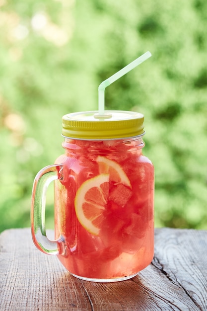 Summer refreshing drink with ice, slices of watermelon, lemon. Summer time, Summer drink