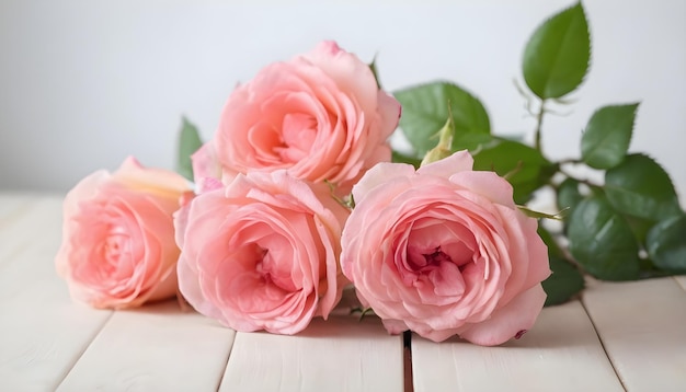 summer roses on a light wooden table