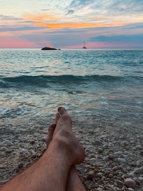 Summer sea vacation laying on the beach enjoying sunset copy space