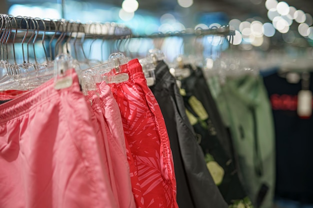 Summer shorts on a hanger for sale in a shopping mall