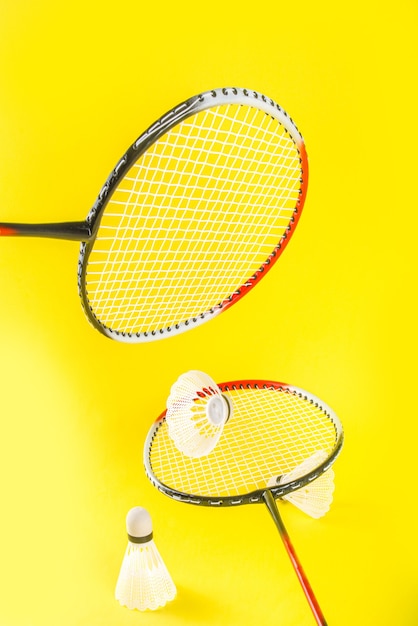 Summer sport activity concept Two badminton paddle rackets with shuttlecocks 