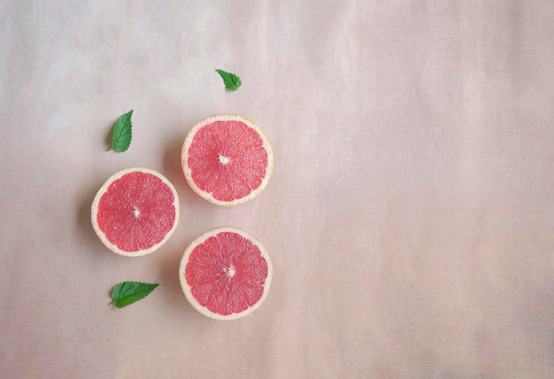 Summer still life with cut grapefruits Top view