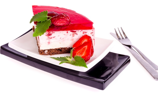 Summer strawberry mousse cake with fresh berries on white background. 