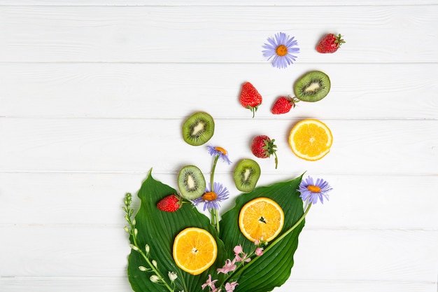 Summer subject, Fruits and flowers on a white board