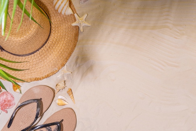 Summer sunny sand background with straw hat