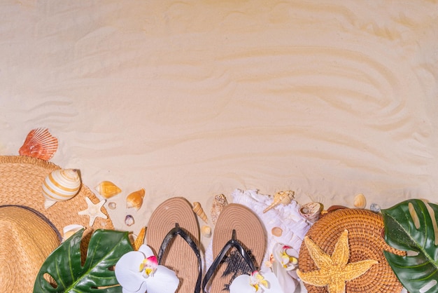 Summer sunny sand background with straw hat