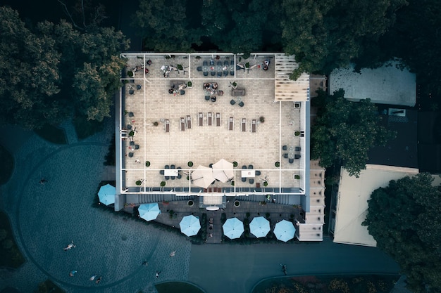 Summer terrace on the roof of luxury restaurant in the park aerial top view