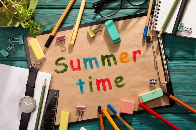 Summer time written with crayons on the paper