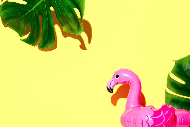 Summer tropical background with copy space for a text  image of inflatable pink flamingo