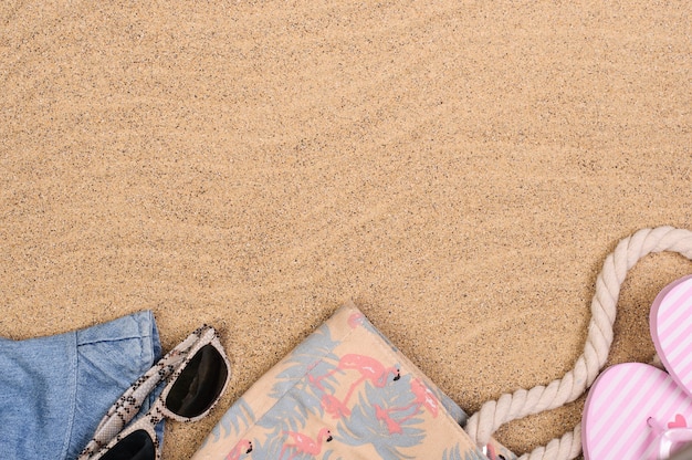 Summer vacation concept, beach accessories on the sand