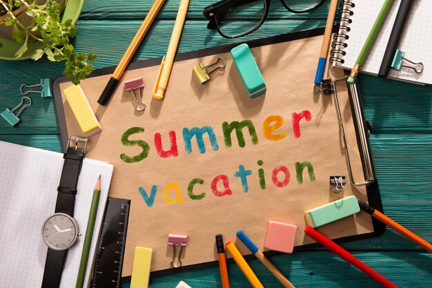 Summer vacation written with crayons on the paper