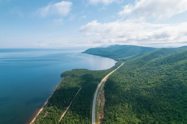 Summertime imagery of Lake Baikal is a rift lake located in southern Siberia, Russia Baikal lake summer landscape view from a cliff near Grandma's Bay. Drone's Eye View.