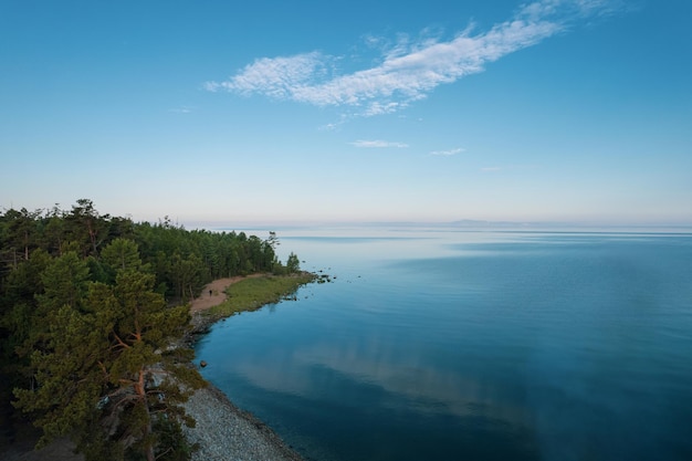 Summertime imagery of Lake Baikal in morning is a rift lake located in southern Siberia, Russia. Baikal lake summer landscape view. Drone's Eye View.