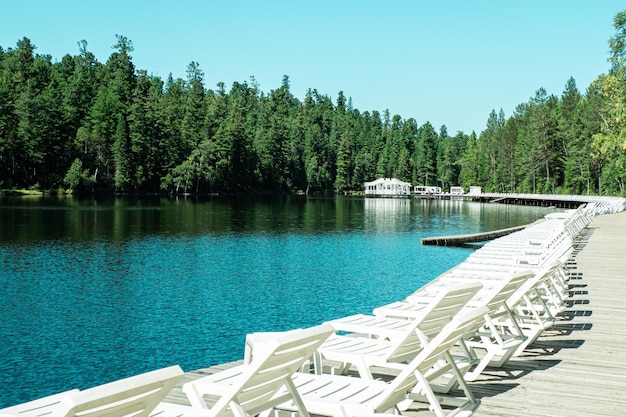 Sun beds in the tourist area on the lake