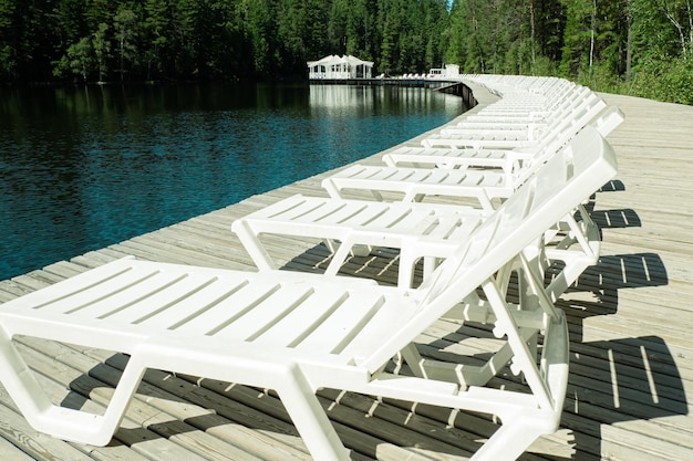 Sun beds in the tourist area on the lake