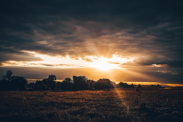 The sun behind the cloud Rays of light from the sun