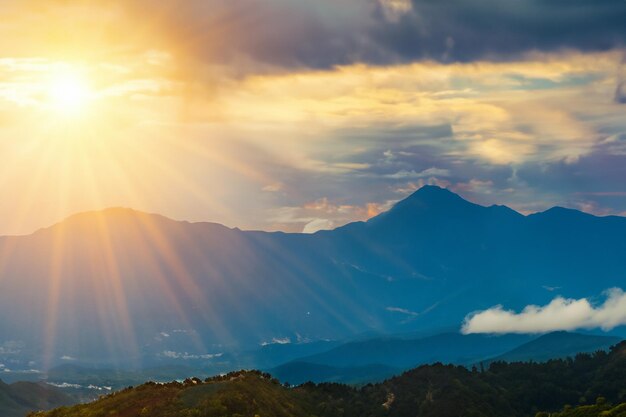 Sun and Clouds Over Mountain Landscapes