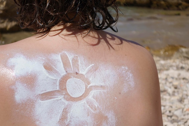 Sun cream drawing in the skin