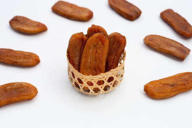 Sun dried bananas on white background.