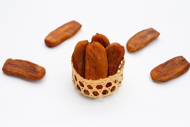 Sun dried bananas on white background.