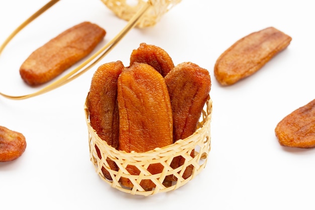 Sun dried bananas on white background