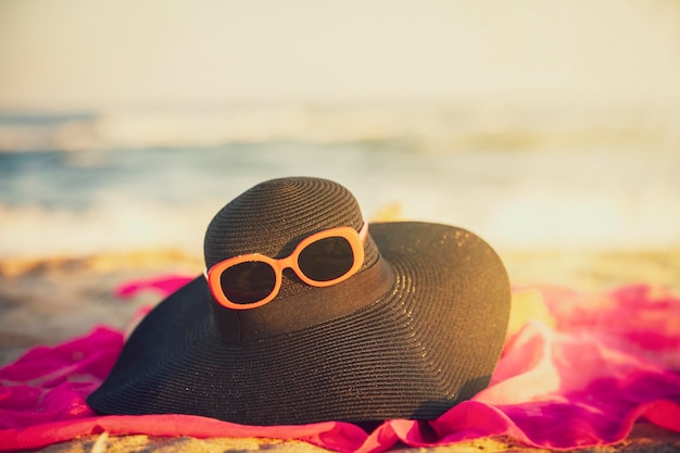 Sun hat glasses on a background of the sea Vacation concept