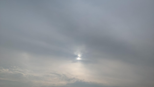 The sun is shining through the clouds