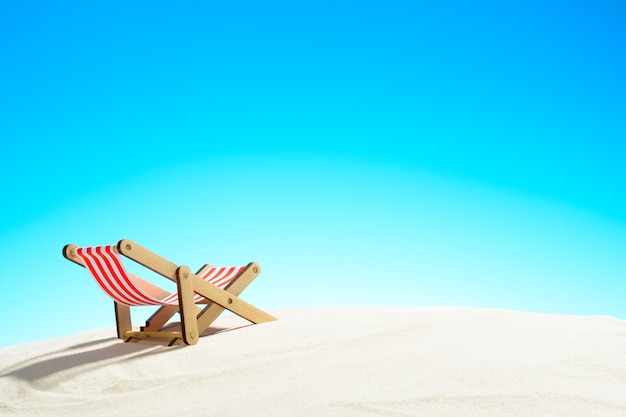 Sun lounger on the sandy beach and sky with copy space summer background