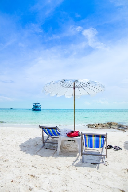 Sun loungers and beach umbrellas on the beach.