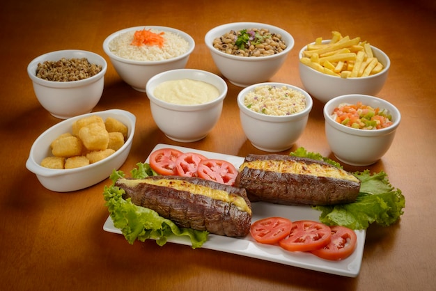 Sun meat and side dishes Carne de sol salted steak typical dish from the Brazilian northeast