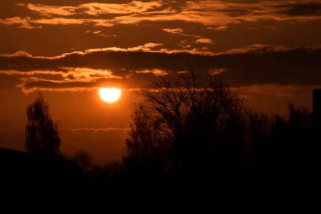 Sun in the red sky at sunrise