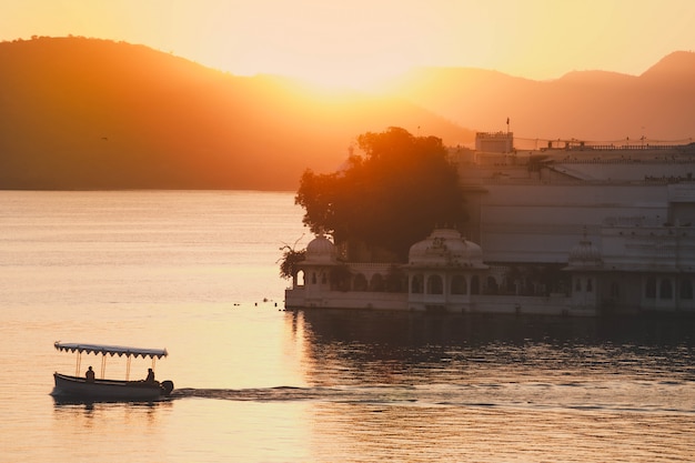 Sun rise in the morning at Taj Lake Palace on Lake Pichola in Udaipur India