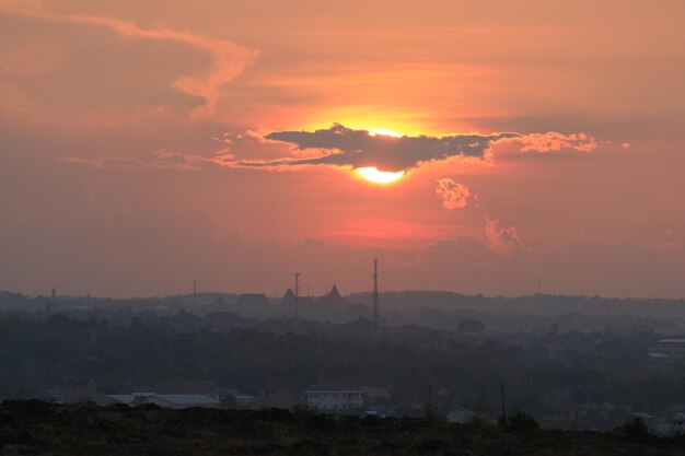 Sun setting over the horizon with vibrant colors Sunset city