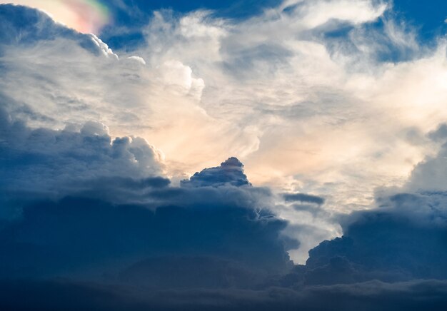 Sun shines through the rain clouds, Before became rainstorm.