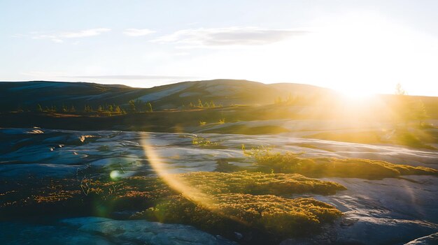 Photo a sun shining over a rocky landscape with a mountain in the background