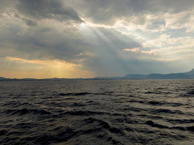 Sunbeams fall on the Mediterranean Sea in southern Italy