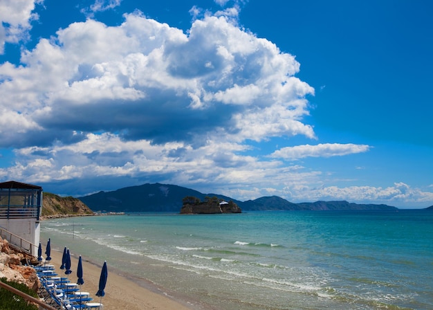 Sunchairs with umbrellas on beautiful beach