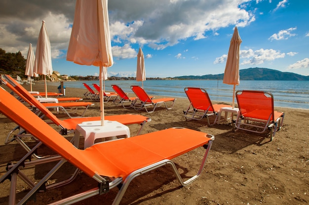 Sunchairs with  umbrellas on beautiful  beach