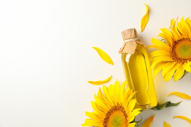 Sunflower and glass jar of oil