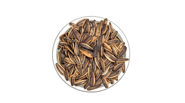 Sunflower seed in a bowl on a white background.