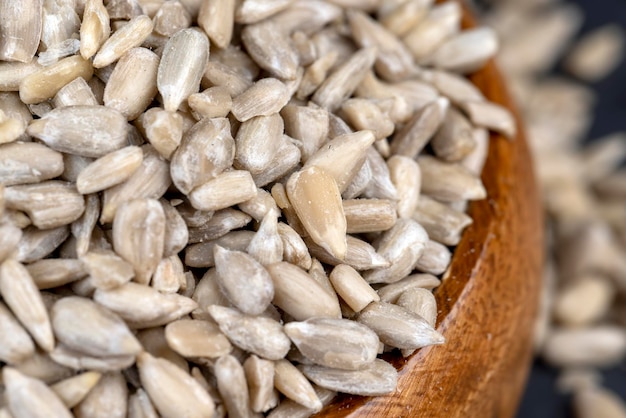 Sunflower seeds peeled from the black shell scattered sunflower seeds peeled from the shell