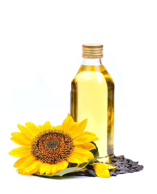 Sunflower with bottle of oil on a white background