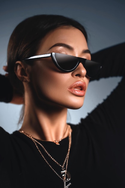 Sunglasses advertising Closeup girl with sun glasses Fashion trendy style woman Beautiful female