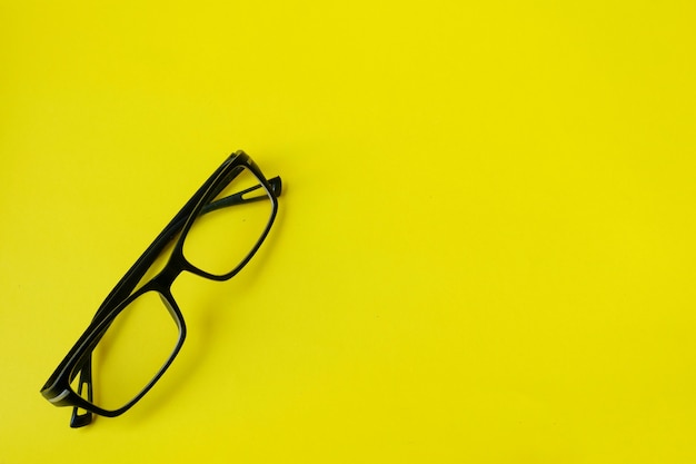 Sunglasses isolated on yellow background