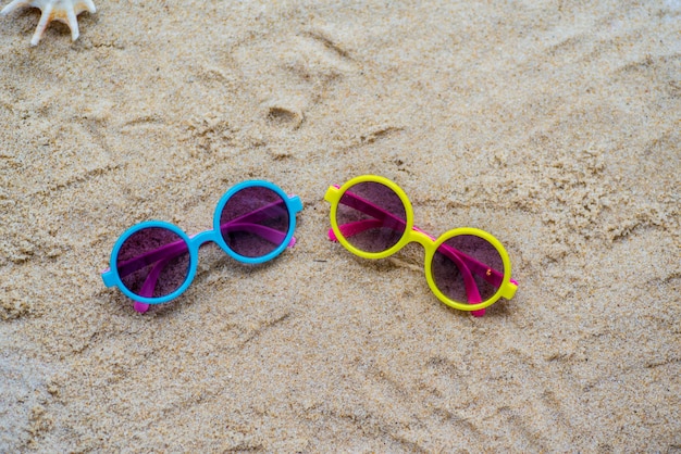 sunglasses in the sand at the beach